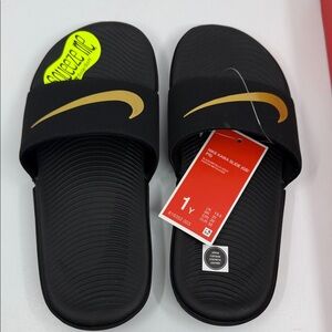 Nike Black Slides with Gold Swoosh